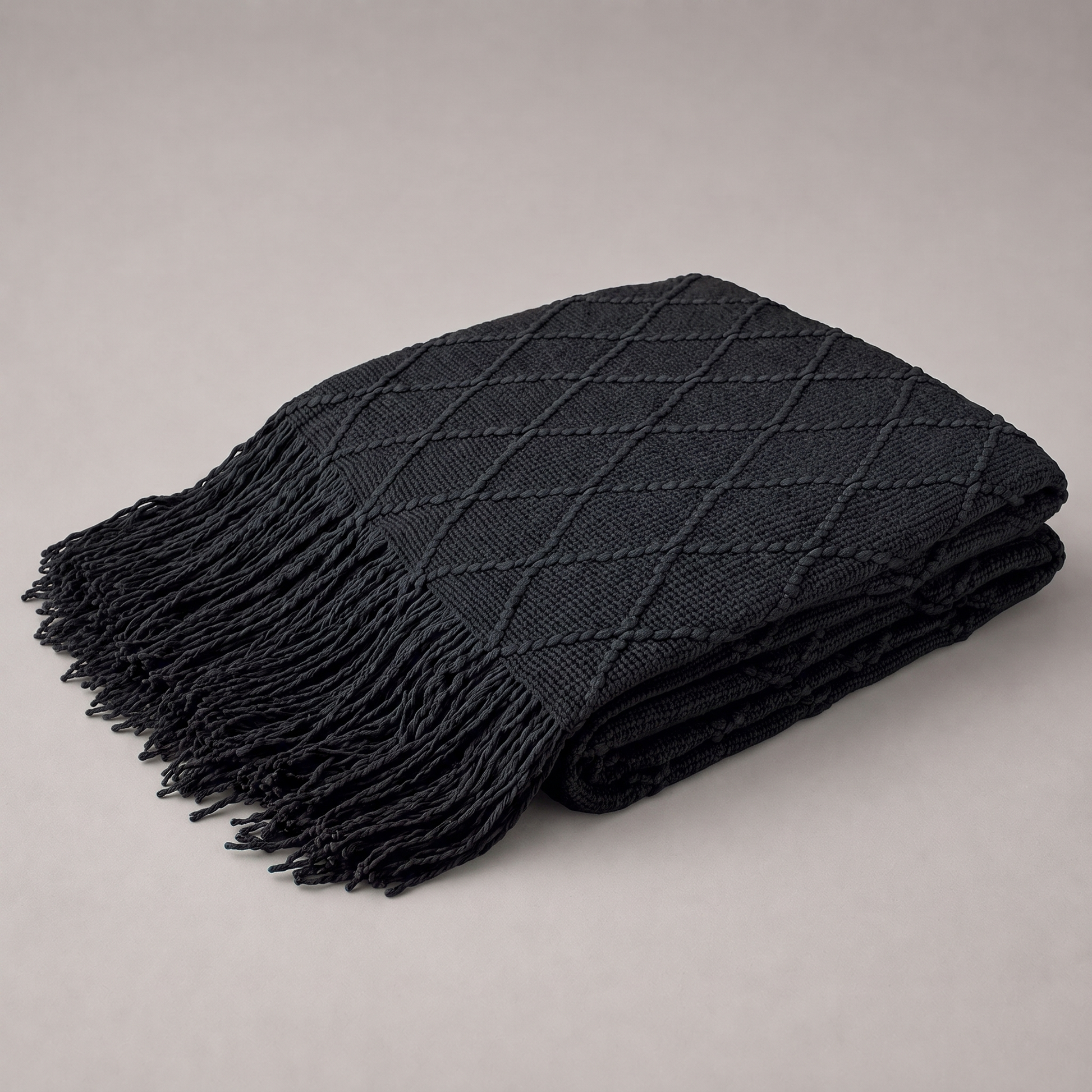 Strickdecke mit Rautenmuster